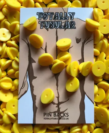 Yellow rubber push on pin badge backs
