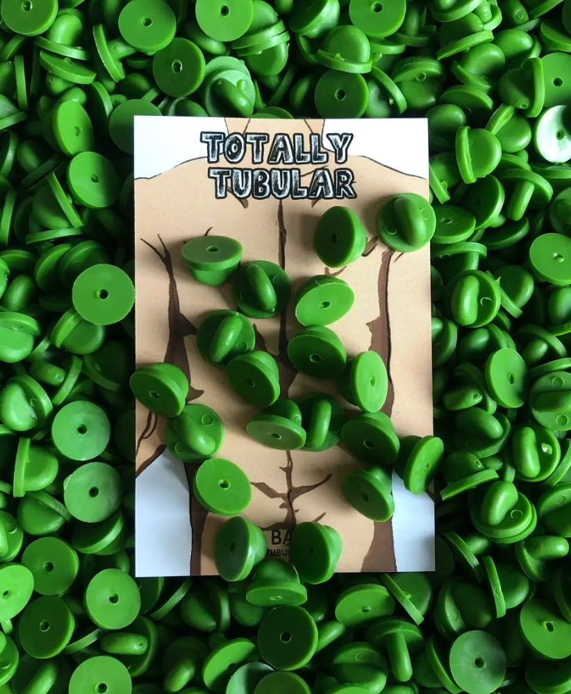 Green Rubber push on pin badge backs Green Rubber push on pin badge backs